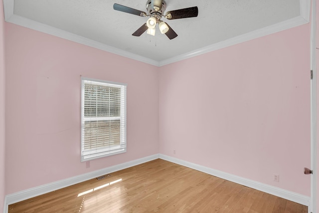 unfurnished room featuring crown molding, ceiling fan, and wood-type flooring