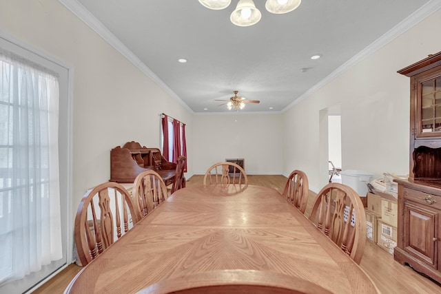 dining space featuring crown molding, ceiling fan, and light hardwood / wood-style flooring