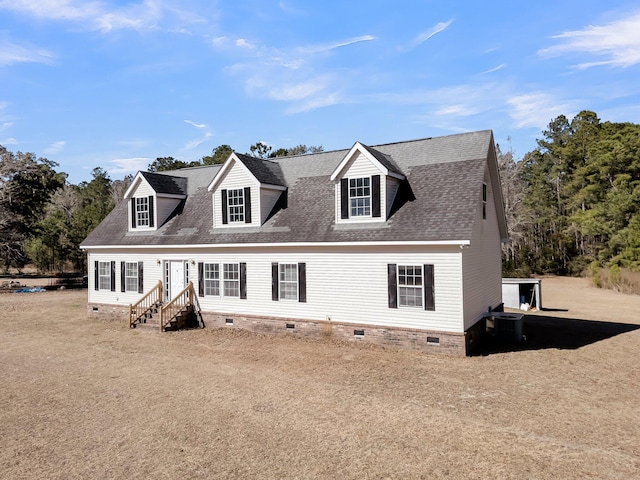 cape cod-style house featuring a front lawn