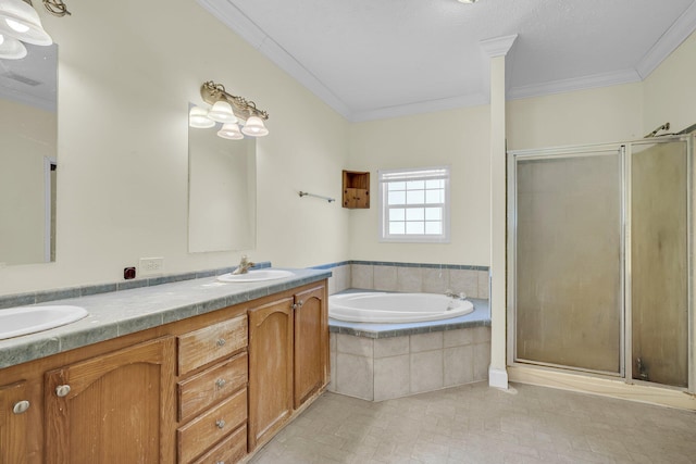 bathroom with vanity, crown molding, and separate shower and tub