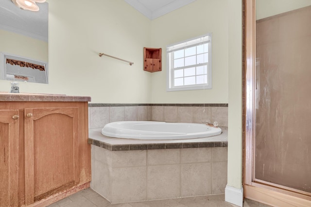 bathroom featuring tile patterned flooring, vanity, ornamental molding, and shower with separate bathtub