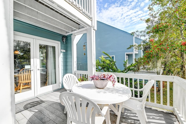 wooden terrace featuring outdoor dining area