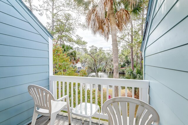 balcony featuring a water view