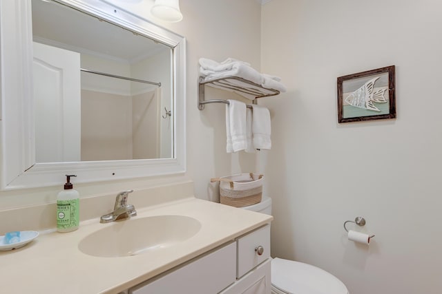 bathroom featuring toilet and vanity