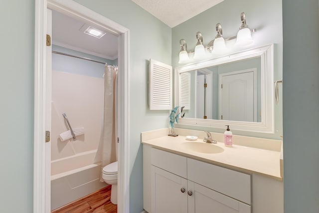 full bath featuring toilet, vanity, wood finished floors, a textured ceiling, and shower / bathtub combination with curtain