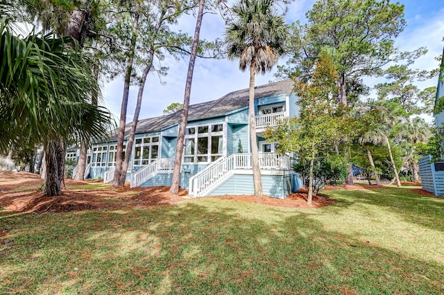 rear view of house with a lawn