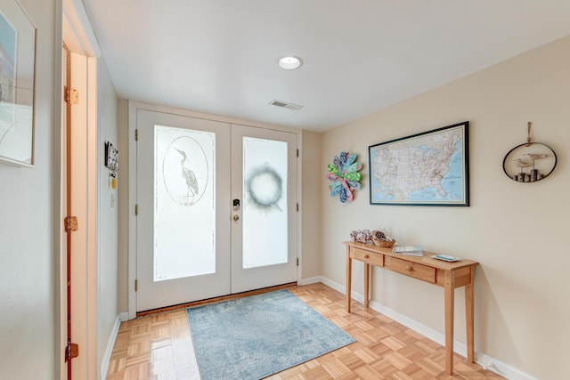 entryway featuring french doors, baseboards, and visible vents