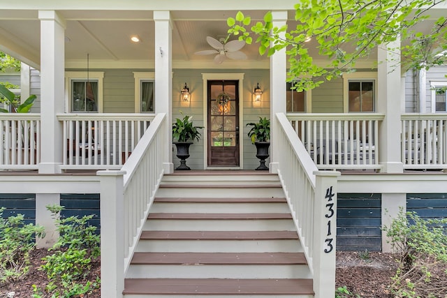 entrance to property with covered porch and ceiling fan