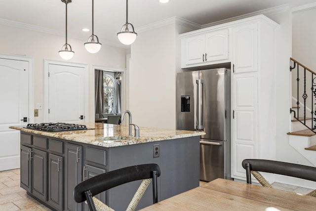 kitchen featuring white cabinets, hanging light fixtures, gray cabinets, appliances with stainless steel finishes, and light stone countertops