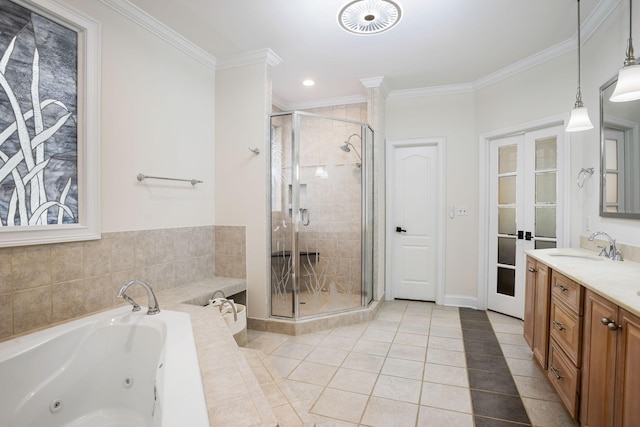 bathroom with ornamental molding, tile patterned floors, vanity, and separate shower and tub