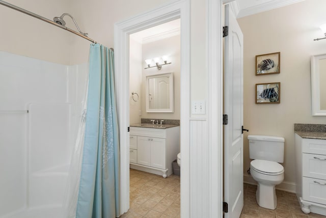 bathroom with walk in shower, vanity, and toilet