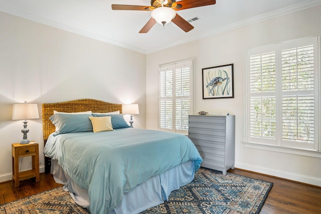 bedroom featuring multiple windows, dark hardwood / wood-style floors, and ceiling fan