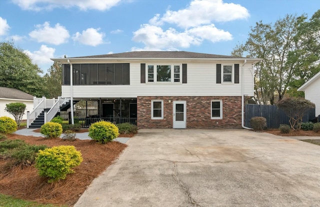 view of front of property with a sunroom