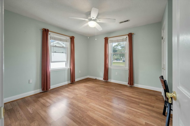 unfurnished room featuring ceiling fan and light hardwood / wood-style flooring