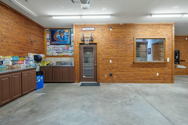 garage featuring wooden walls