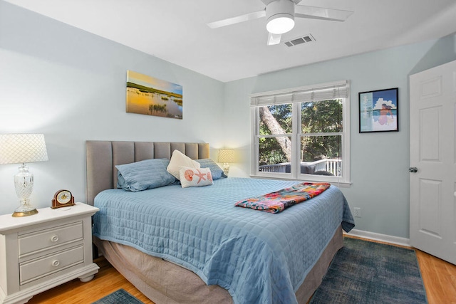 bedroom featuring wood-type flooring and ceiling fan