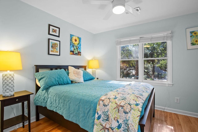 bedroom featuring ceiling fan and hardwood / wood-style flooring