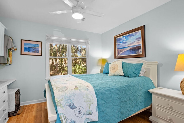 bedroom with ceiling fan and light hardwood / wood-style flooring