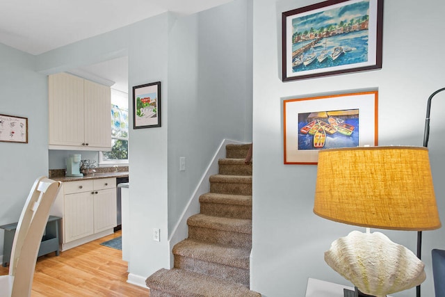 stairway featuring hardwood / wood-style floors