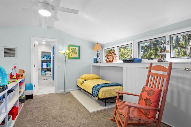 bedroom with ceiling fan, carpet flooring, vaulted ceiling with beams, and ensuite bath