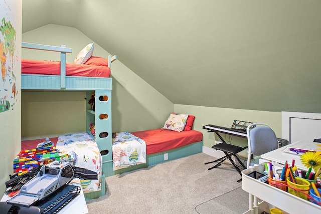 carpeted bedroom with vaulted ceiling