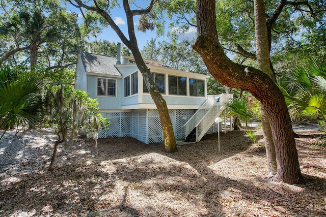 back of property featuring a sunroom