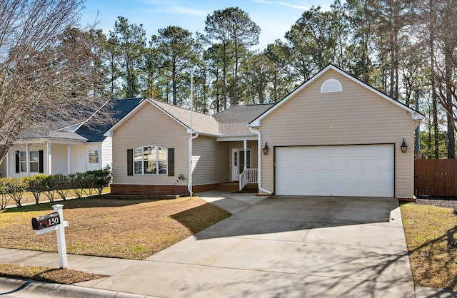 ranch-style house with a garage and a front lawn