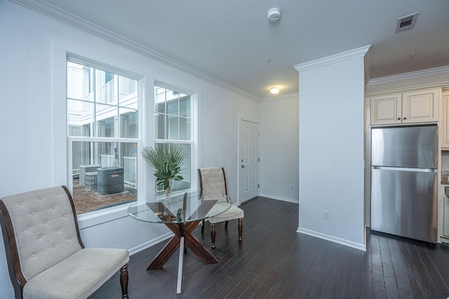 living area featuring crown molding and dark hardwood / wood-style floors