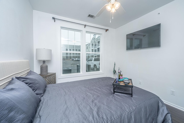 bedroom with wood-type flooring and ceiling fan