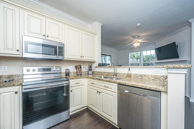 kitchen featuring dark hardwood / wood-style floors, sink, ceiling fan, stainless steel appliances, and crown molding