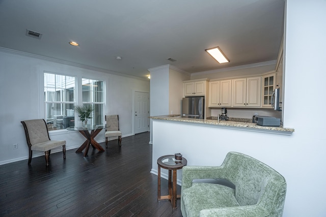 kitchen with ornamental molding, dark wood-type flooring, stainless steel appliances, and kitchen peninsula