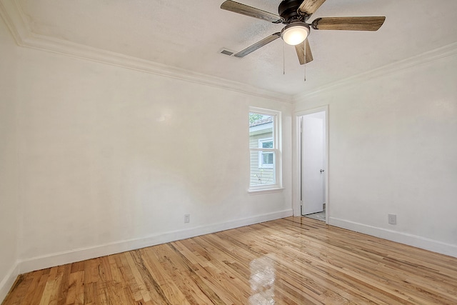 unfurnished room featuring light wood-type flooring, baseboards, ornamental molding, and ceiling fan