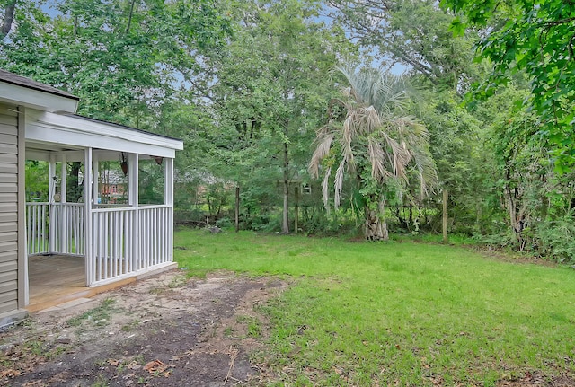 view of yard featuring a sunroom