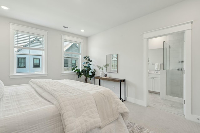 bedroom with light carpet, recessed lighting, visible vents, and baseboards