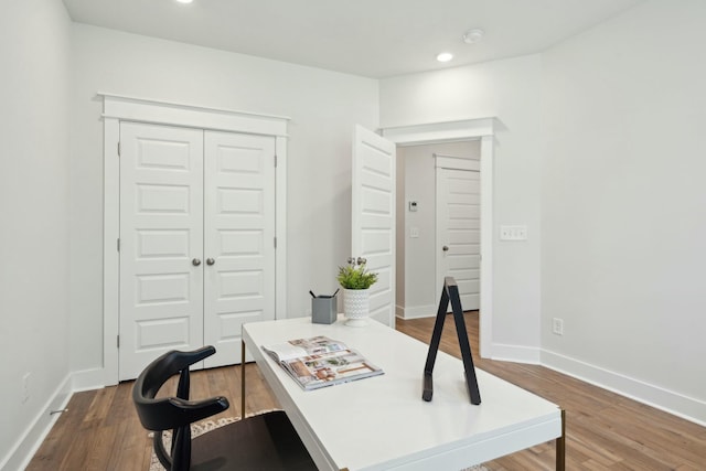 office featuring recessed lighting, baseboards, and wood finished floors