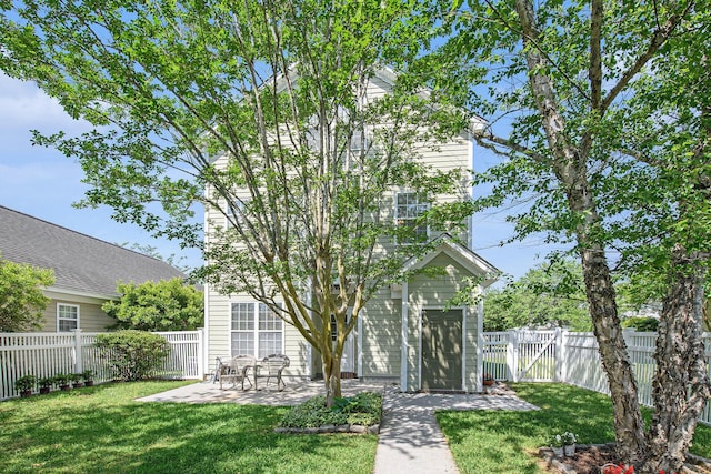 exterior space with a patio area, a fenced backyard, and a gate