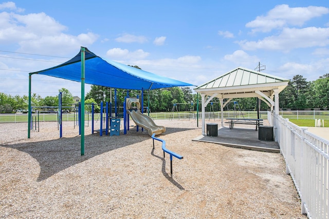 community jungle gym with fence and a gazebo