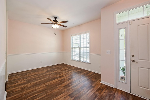 entryway with baseboards, a ceiling fan, and dark wood-style floors
