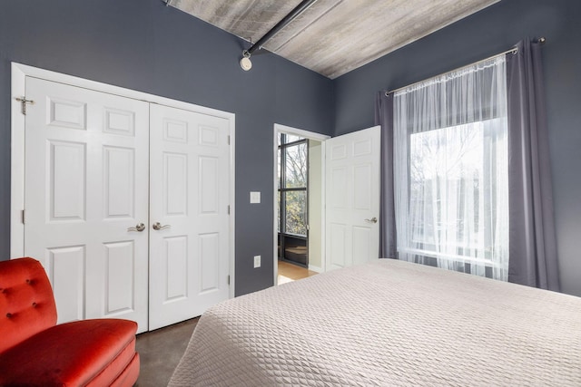 bedroom featuring a closet and multiple windows