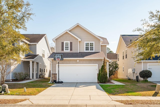 traditional-style house with a garage, driveway, roof with shingles, and a front yard