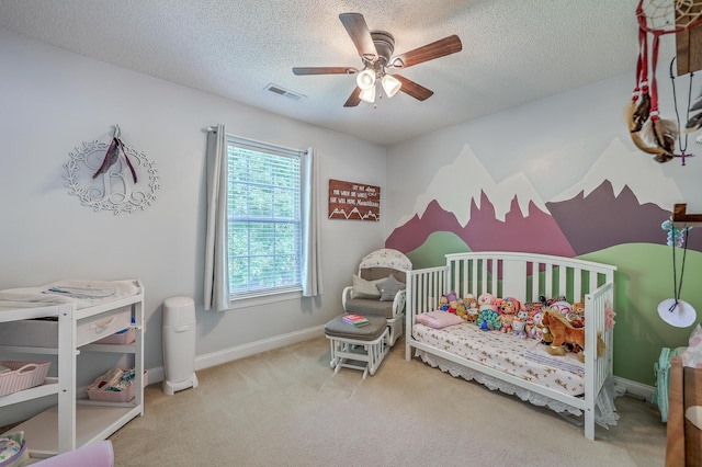 111 Kapalua Run, Summerville, SC 29483 - bedroom with carpet, baseboards, a crib, ceiling fan, and a textured ceiling