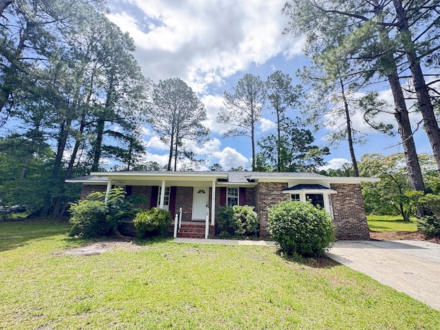 710 Gadsden Loop, Walterboro, SC 29488 - single story home with a front lawn and brick siding