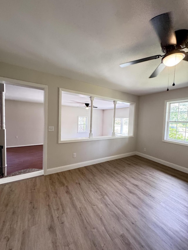 710 Gadsden Loop, Walterboro, SC 29488 - unfurnished room featuring wood finished floors, a ceiling fan, and baseboards