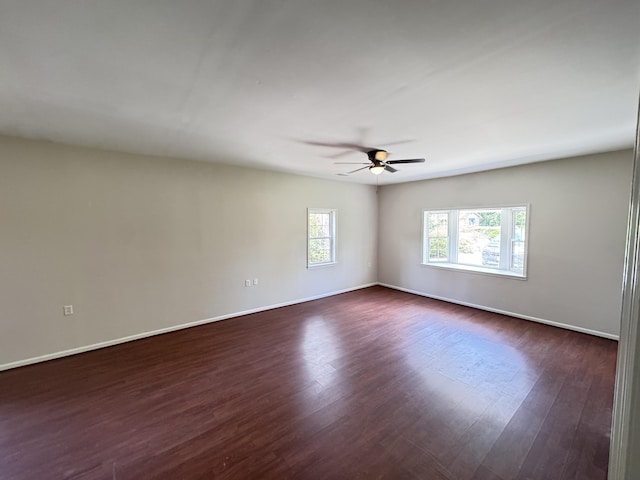 710 Gadsden Loop, Walterboro, SC 29488 - empty room featuring dark wood-style floors, a ceiling fan, and baseboards
