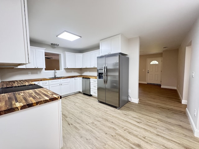 710 Gadsden Loop, Walterboro, SC 29488 - kitchen featuring stainless steel appliances, butcher block counters, a sink, baseboards, and light wood-type flooring