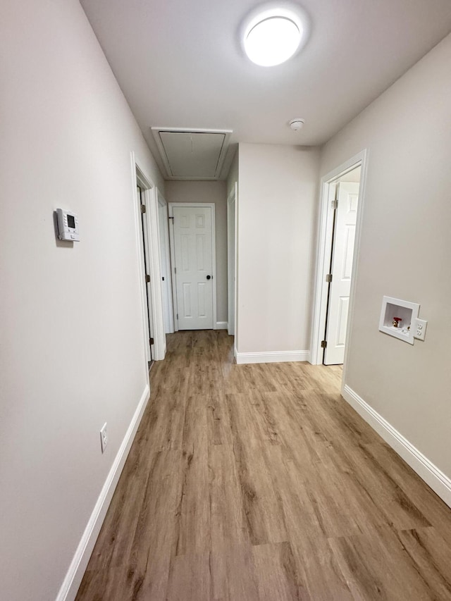 710 Gadsden Loop, Walterboro, SC 29488 - hall with attic access, light wood-style floors, and baseboards
