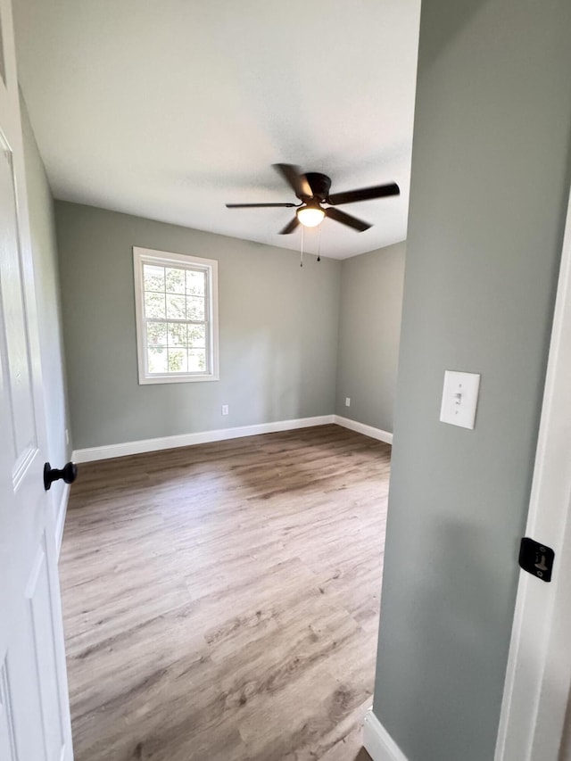 710 Gadsden Loop, Walterboro, SC 29488 - empty room featuring a ceiling fan, wood finished floors, and baseboards