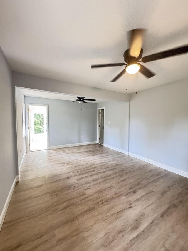 710 Gadsden Loop, Walterboro, SC 29488 - unfurnished room featuring ceiling fan, wood finished floors, and baseboards