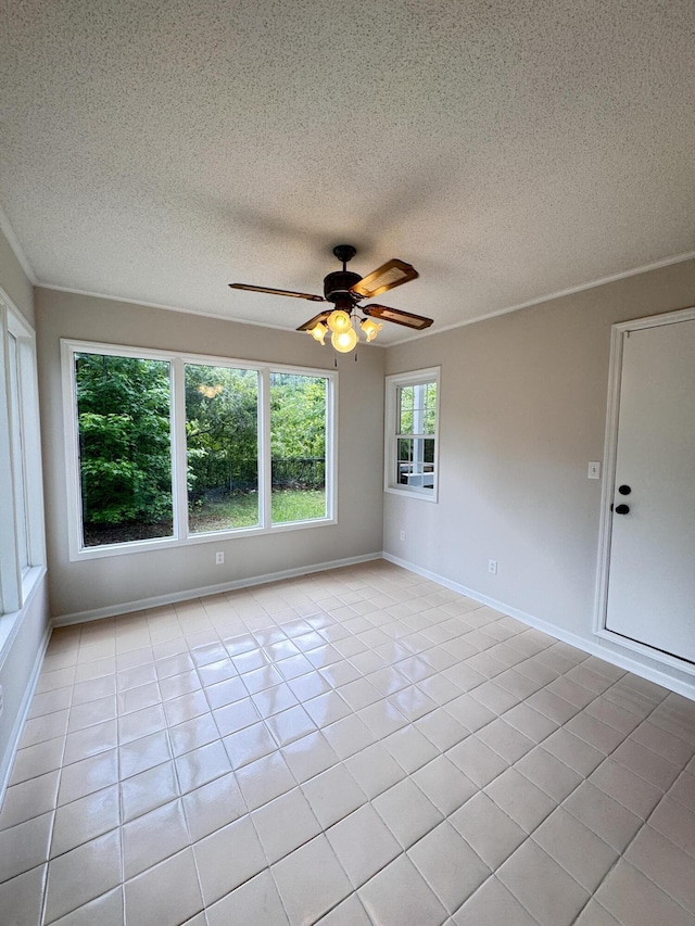 710 Gadsden Loop, Walterboro, SC 29488 - unfurnished room with a ceiling fan, a textured ceiling, light tile patterned floors, and baseboards