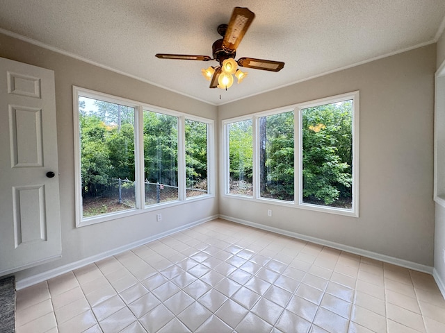 710 Gadsden Loop, Walterboro, SC 29488 - unfurnished sunroom with healthy amount of natural light, crown molding, a textured ceiling, tile patterned floors, and baseboards